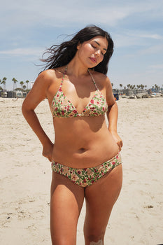 woman at the beach wearing a tapestry bikini