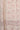 Close-up of a floral patterned fabric with pink and beige colors.