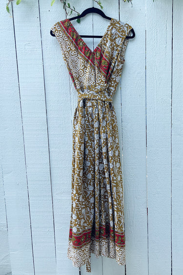 Patterned dress hanging on a wooden surface