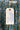 Close up of hang tag showing broomstick pleat laundering instructions.