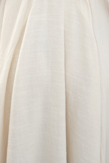 Close-up of off white alabaster osnaburg showing fabric texture.