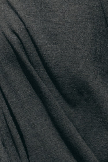fabric swatch of jet black osnaburg showing texture 