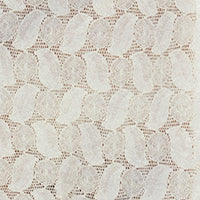 Textured beige lace with small white shapes